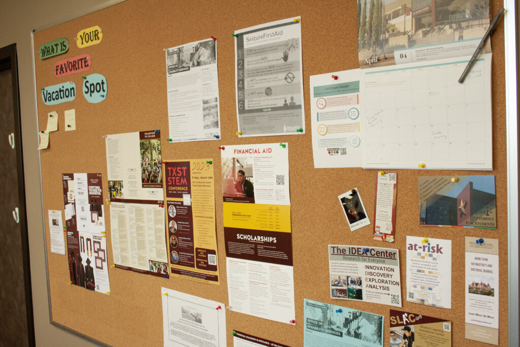 bulletin board with flyers and notices pinned to it